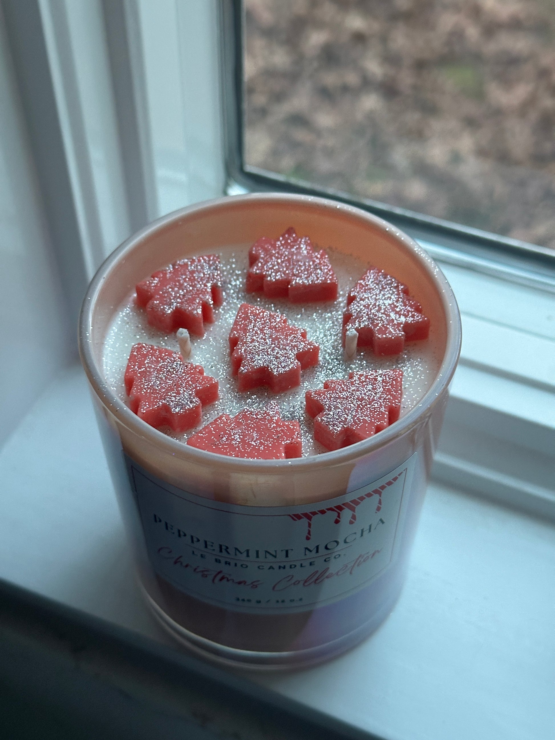 Peppermint Mocha Soy Candle with Christmas trees